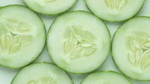 Top view of fresh sliced cucumber rotation Stock Footage 130761281