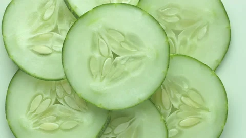 Top view of fresh sliced cucumber rotation Stock Footage 130765854