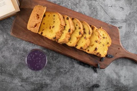 Top view of fresh sliced roulette with grape cocktail on grey background Stock Photos