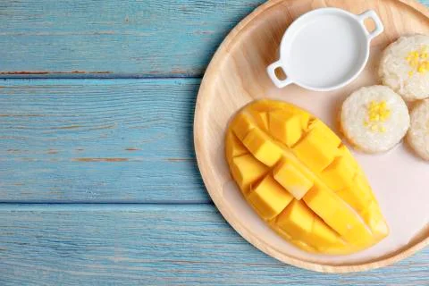 Top view Fresh yellow mango peel and Sliced cubes with sticky rice ,coconut m Stock Photos