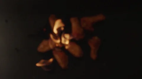 Top view of fried chicken wings flying upwards with blazing fire Stock Footage 116649543