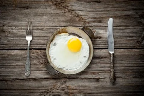 Top view of fried egg on wooden Stock Photos