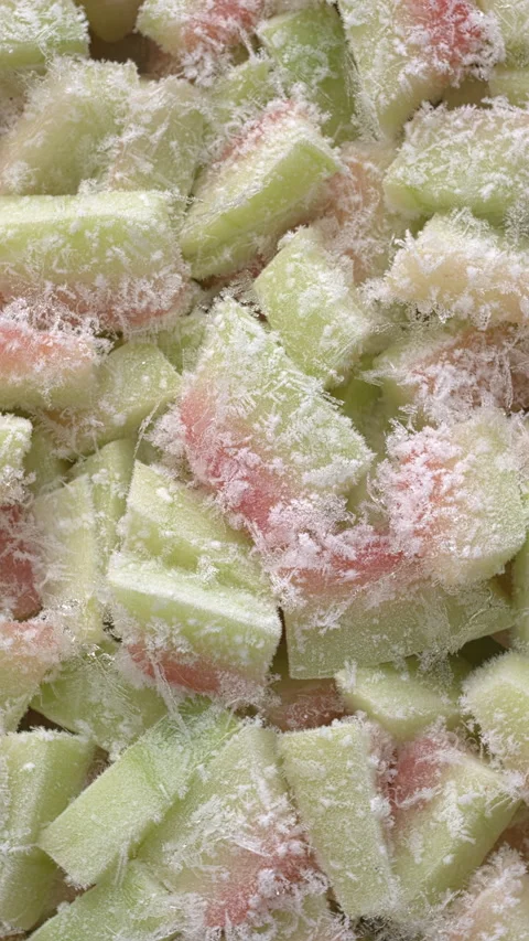 Top view of frozen chunks of watermelon rind. Vertical video. Stock Footage 311895337