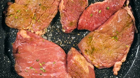Top view of frying beef steak in a frying pan. Meat preparation Stock Footage 66448144