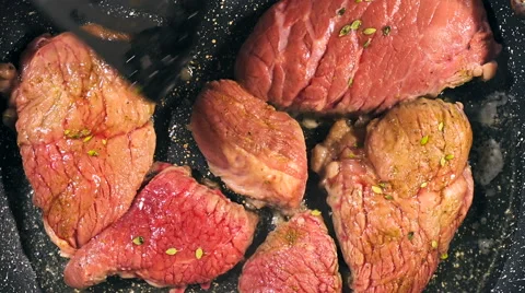 Top view of frying beef steak in a frying pan. Meat preparation Stock Footage 66448186