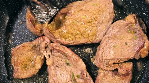 Top view of frying beef steak in a frying pan. Meat preparation Stock Footage 66448392