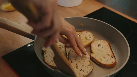 Top view of frying bread toasts in the pan, the process of cooking fast snack Stock Footage 240730596