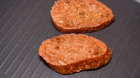 Top view of frying bread toasts in the pan Stock Footage 250088679