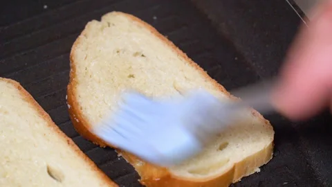 Top view of frying bread toasts in the pan Stock Footage 251876604