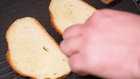 Top view of frying bread toasts in the pan Stock Footage 251876638