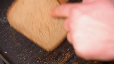 Top view of frying bread toasts in the pan Stock Footage 251953013