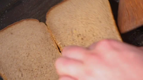 Top view of frying bread toasts in the pan Stock Footage 251953020