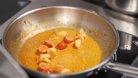 A top view of a frying pan with vegetable mixture in a sauce Stock Footage 102165811
