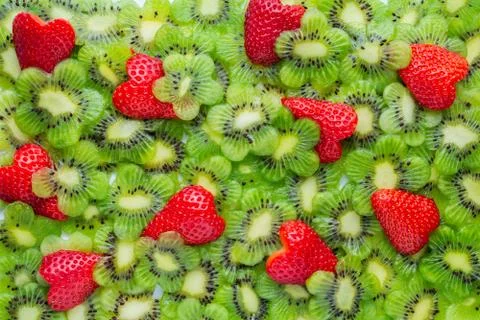 Top view of funny creative concept sliced kiwi flower shape and strawberry he 스톡 사진