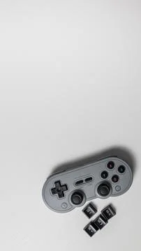 Top view of a gamepad on white background. Copyspace. Stock Photos