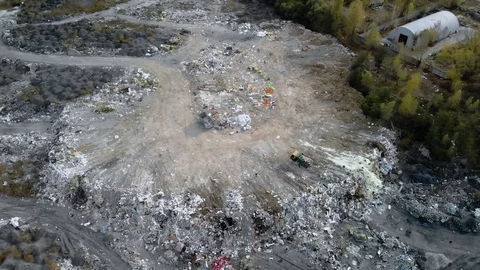 Top view of a garbage dump. A truck unloads garbage in a landfill. 4k Stock Footage 122389788