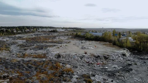 Top view of a garbage dump. A truck unloads garbage in a landfill. 4k Stock Footage 123024964