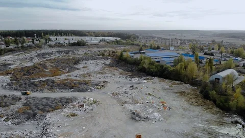 Top view of a garbage dump. A truck unloads garbage in a landfill. 4k Stock Footage 123025053