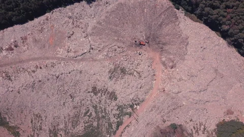 Top view of a garbage dump where machinery equals mountains of household waste Stock Footage 138352790