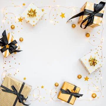 Top view of gift boxes in various black, white and golden designs, shining .. Stock Photos