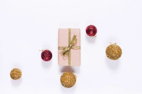 Top view of gift boxes in wrapping paper with ribbon and christmas balls Stock Photos