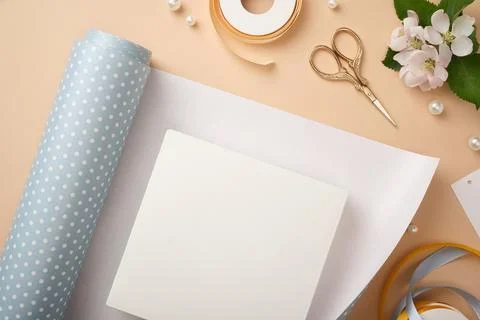 Top view of gift wrapping layout with white box on polka dot paper, gold sc.. 스톡 사진