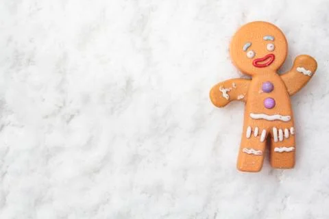 Top view of gingerman on snowy background with copy space Stock Photos