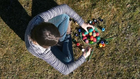 Top view of a girl coloring Easter eggs Stock Footage 73461708