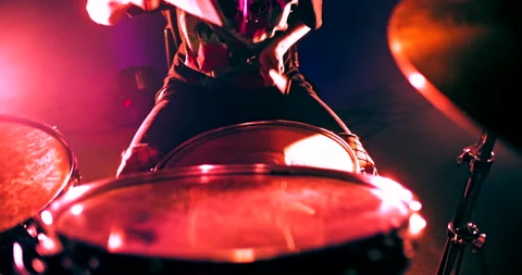 Top view of girl emphatically playing the drum kit in twinkling strobe lights Stock Footage 172010786