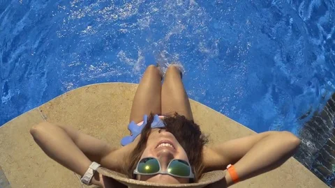 Top view of a girl by the pool Stock Footage 83621109