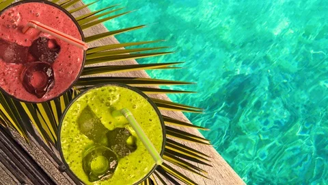 Top view. Glasses with two straws filled with  smoothie.  Summer refreshment Stockbeeldmateriaal 112372699