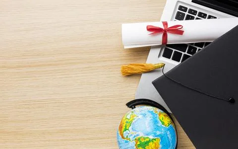 Top view globe with academic cap laptop. High quality and resolution beautiful Stock Photos