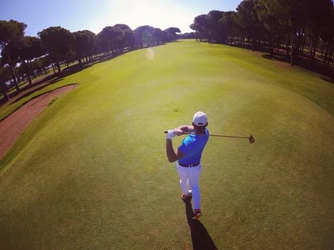 Top view of golf player hitting shot Photos