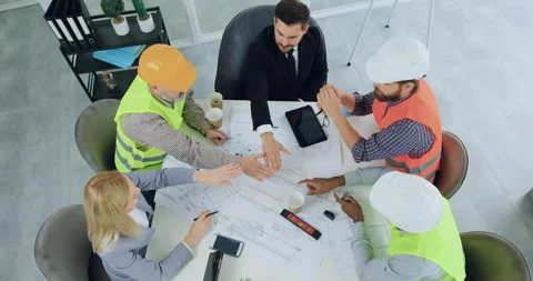 Top view of good-looking positive experienced multiracial team of engineers and Stock Footage 145605959