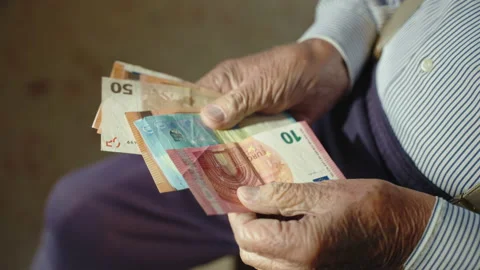 Top view of grandfather counting stack of euro banknotes in his wrinkled hands Stock Footage 168257485