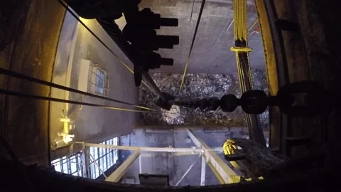 Top view of a grapple grabbing garbage cans in a factory Video stock 158750635