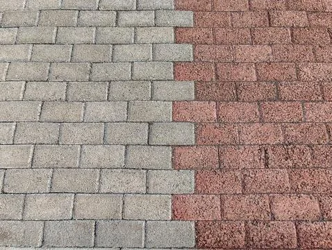 Top view of gray and red interlocking concrete paving blocks Stock Photos