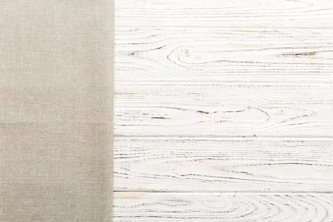 Top view with gray kitchen napkin isolated on table background. Folded clot.. Stock Photos
