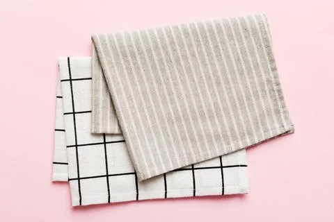 Top view with gray kitchen napkin isolated on table background. Folded clot.. Stock Photos