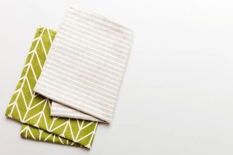 Top view with gray kitchen napkin isolated on table background. Folded clot.. Stock Photos
