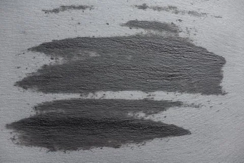 Top view of gray slate surface with wet marks Stock Photos