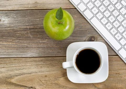 Top view of green apple, selective focus on top leaf and coffee, black coffee Stock Photos