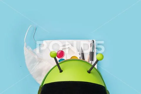 Top view of green backpack with school stationery. preschool back to school Stock Photos