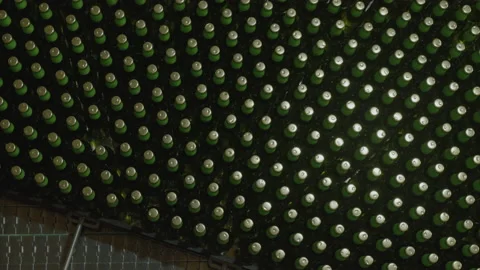 Top view of green beer bottles on the production line of the plant Stock Footage 189287873