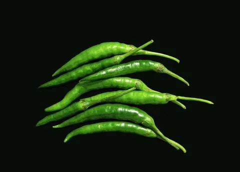 Top view of green chilies on black background Foto stock