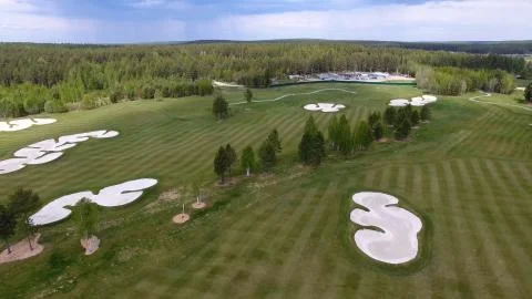 Top view green golf course outdoor green grass field. Aerial view from flying Stock-Fotos
