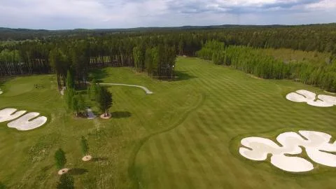 Top view green golf course outdoor green grass field. Aerial view from flying Stock-Fotos