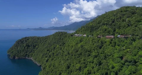 Top view of the green slope of the mountain by the sea. Stock Footage 102847474