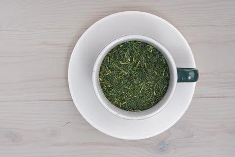 Top view green tea cup on white wooden background Stock Photos