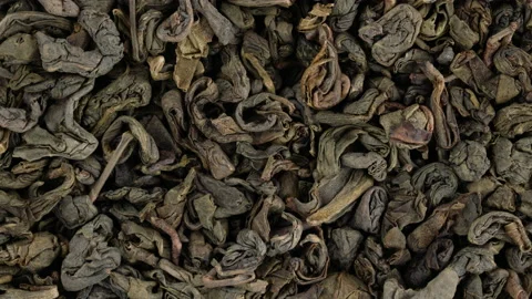 Top view of green tea leaves rotating. Closeup. Macro. Stock-Footage 170646048